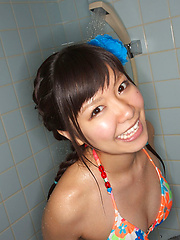 Sweet Ayana Tanigaki smiles and poses at the kitchen with banana