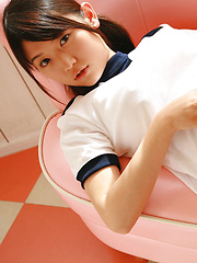 Noriko Kijima Asian in sports equipment is playful in the house