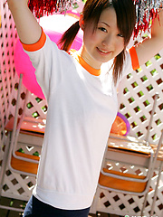 Naoko Sawano Asian in sports outfit plays with balls in garden