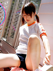 Naoko Sawano Asian in sports outfit plays with balls in garden